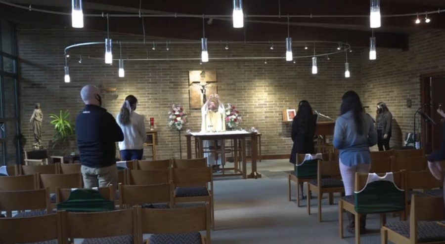 Sacristans, Mr. Paul Hogan, and Father Pat celebrating Friday liturgy. Courtesy of JCTV. 
