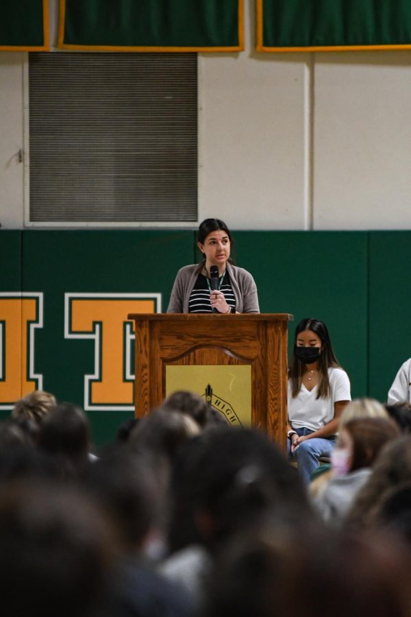 Ms. Blumhardt, the club moderator, speaking at the fall sports assembly.