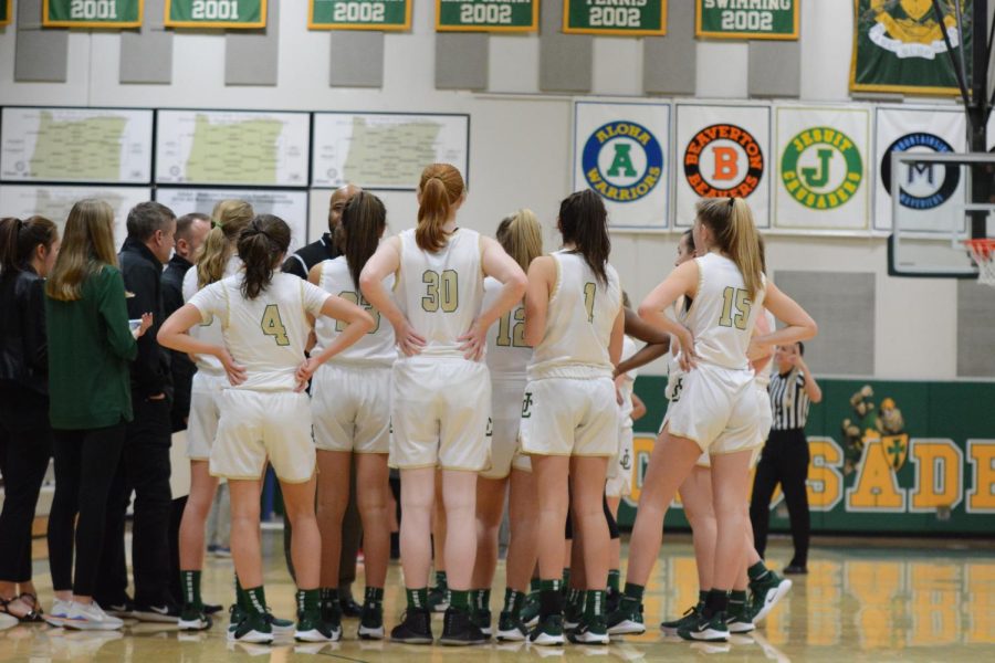 Jesuits Women’s Varsity basketball team during a timeout.