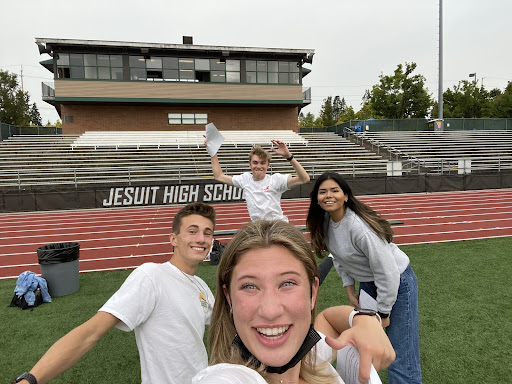 Student government officials Anton Bareceviv, James Miller, Catie Dice, and … prepare for an all school assembly in fall, 2021