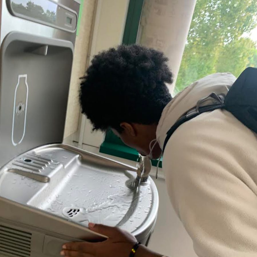 Senior Abeil Melles drinks from the Upper Arrupe water fountain 