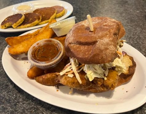 The Big’s Fried Chicken Sandwich with a side of Jojo’s and two signature sauces with griddle corn cakes on the side