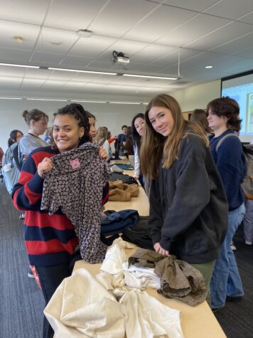 Students shop in the Cardoner room at Tuesday’s clothing exchange organized by Green Team and Fashion Club.