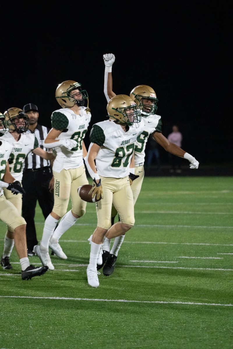 Nick Zervas celebrates with the boys after getting an interception.
