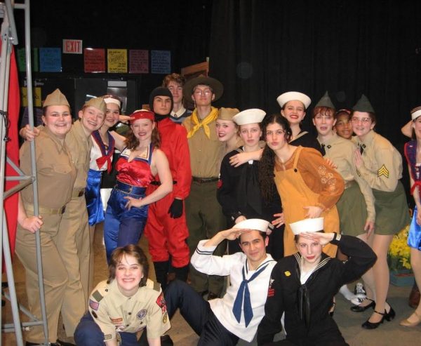 The cast of Big Fish gathers around for a group picture after the USO dance scene.