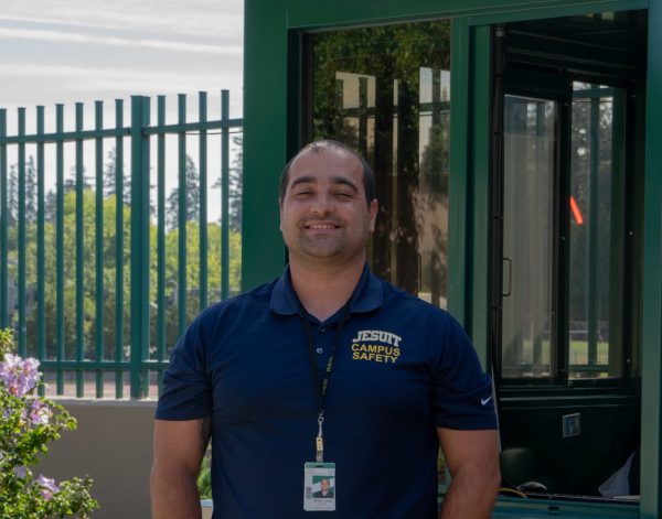 Skylar Lopez in front of Security booth outside knight lobby. 