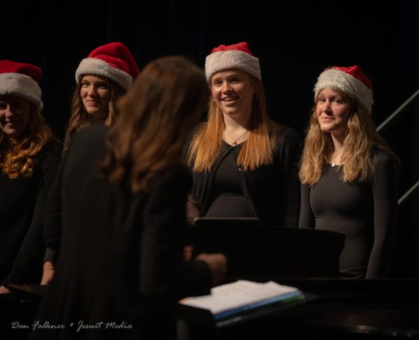 Members of the choir sing during the Christmas concert, led by Ms. Caldwell