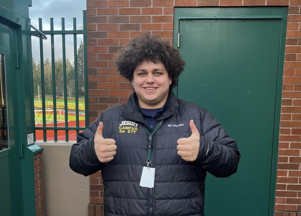 Mr. Perez in front of the security booth outside of Knight Lobby