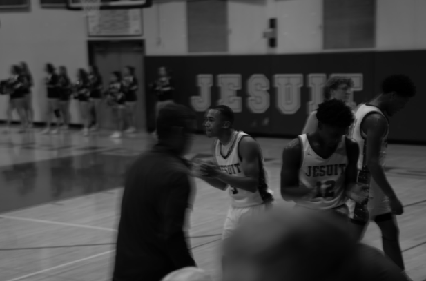 Jesuit celebrates during a timeout. 