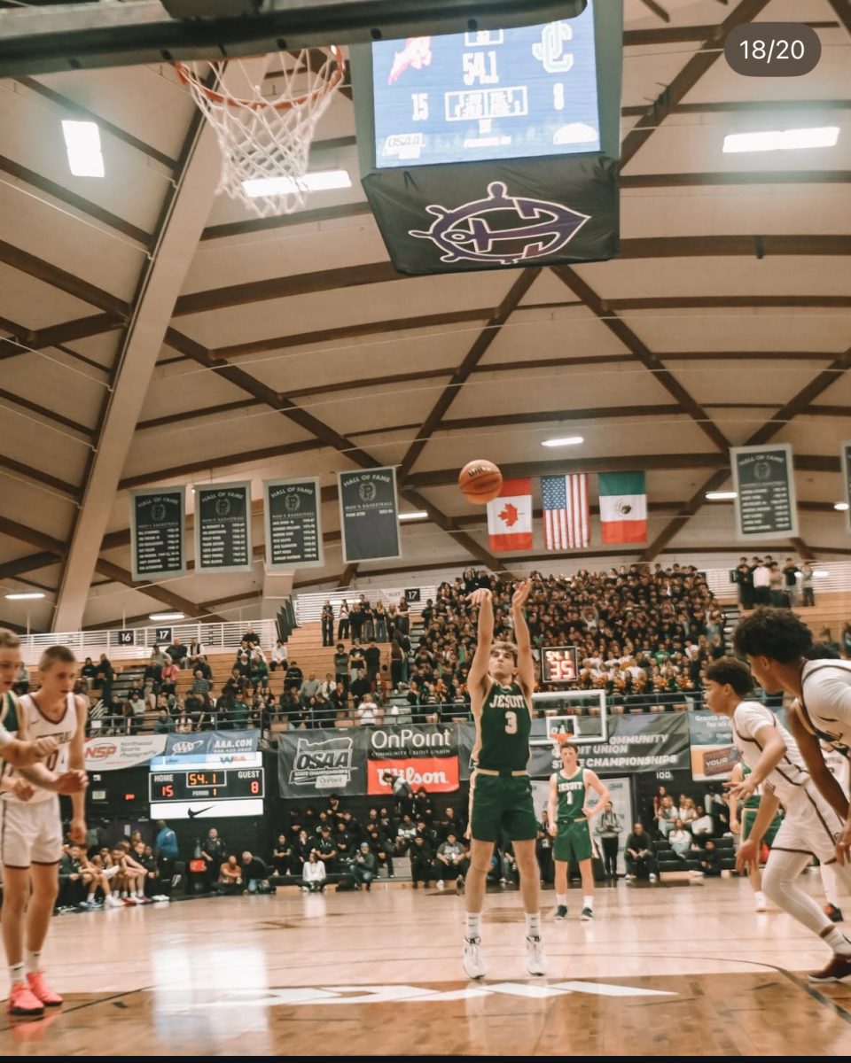 Ryan Fraser hitting a free throw with a sea of Jesuit fans behind him. 

Courtesy of Carlos Regnier