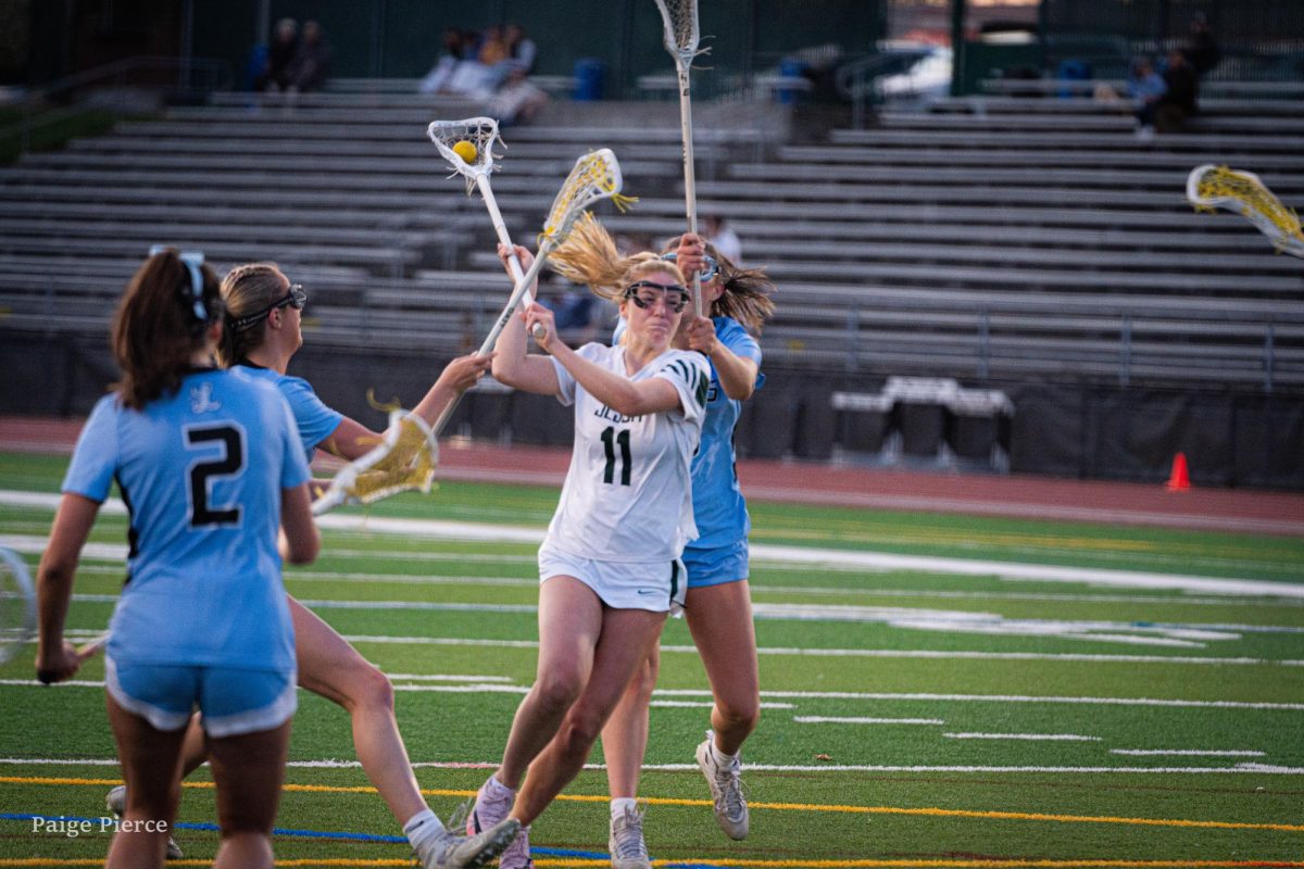 Jesuit attack Quinny Handley shoots against Lakeridge at Cronin Field. 
