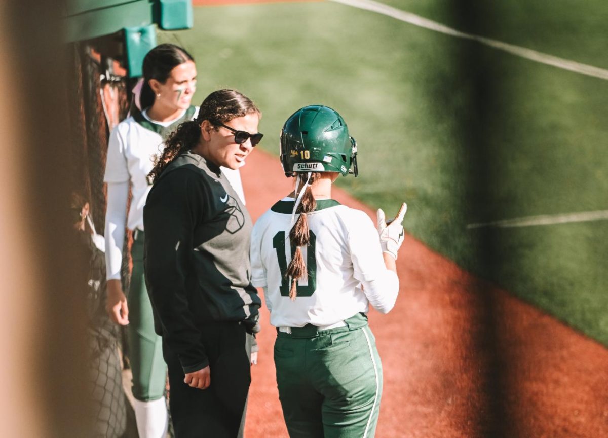 Shikara Lowe coaching the current Jesuit softball team