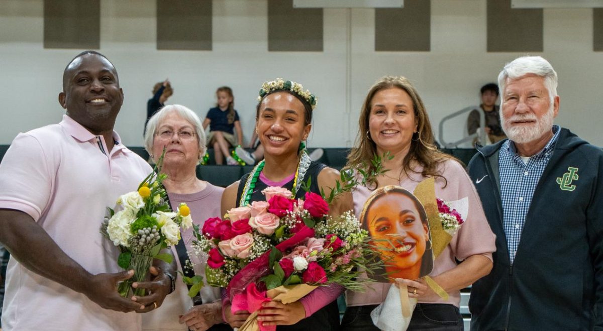 Senior Jada Johnson and her family on senior night