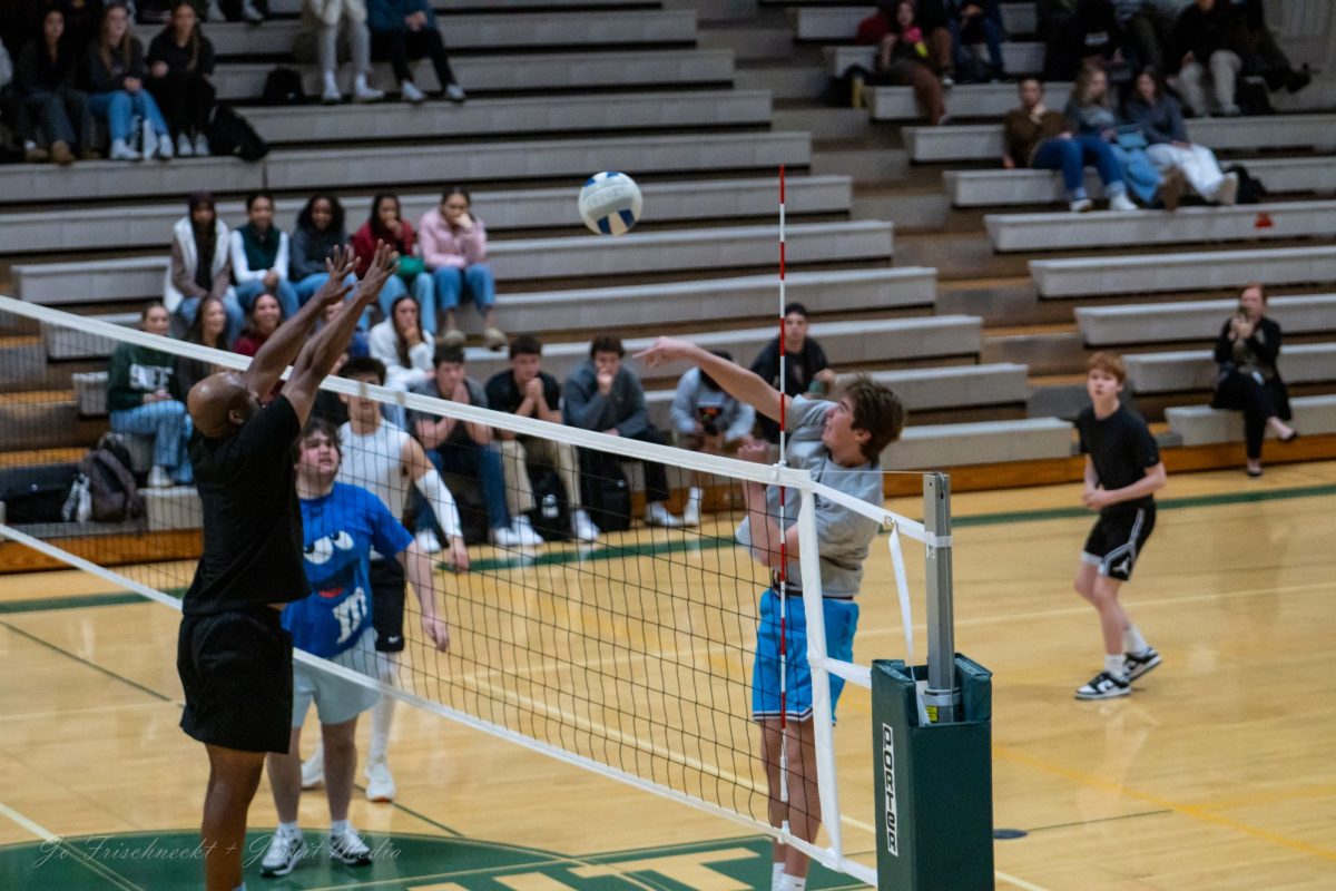 Boys compete in volleyball against the faculty in a faculty vs students volleyball game. Could they take up official 6A competition in the OSAA's newest sport?