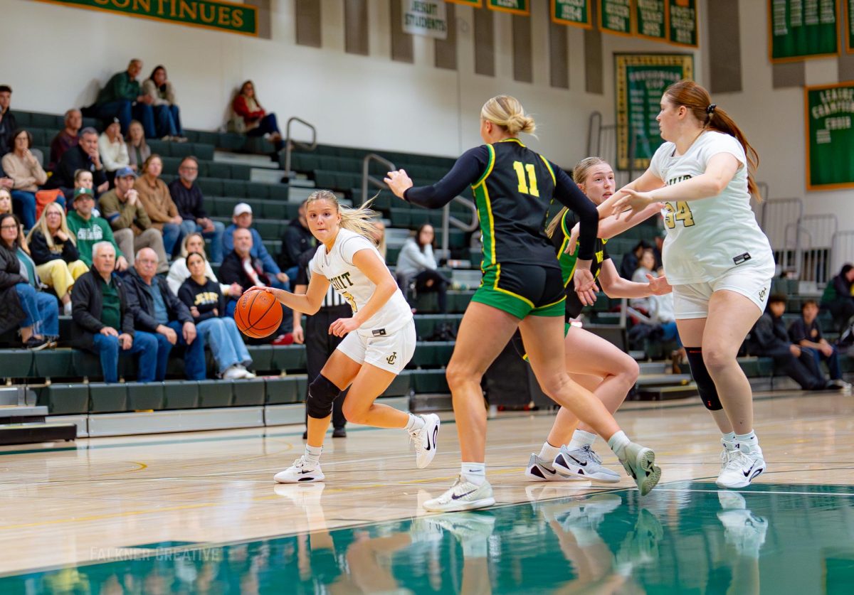 Sophia Costarella drives against West Linn.