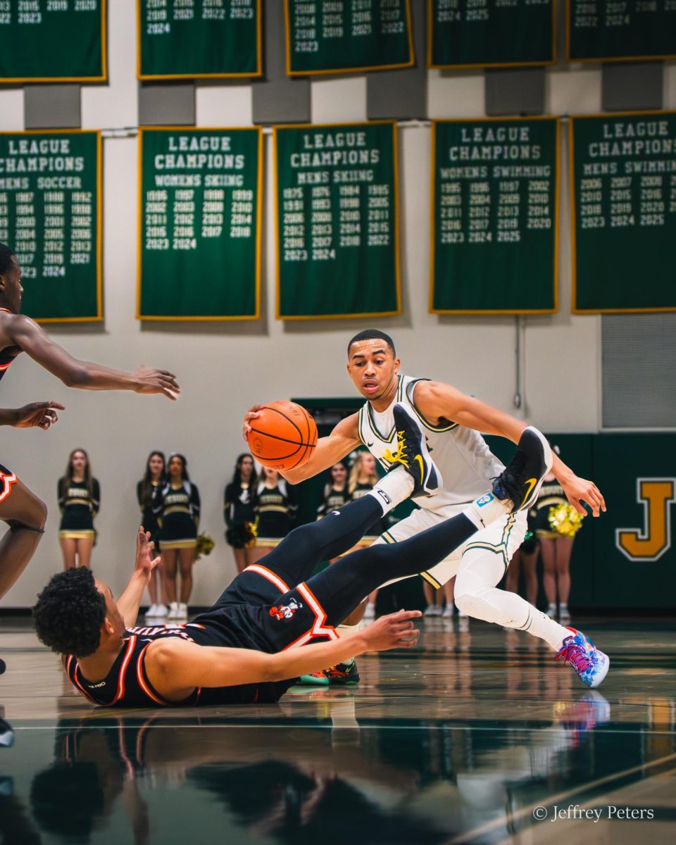 Penny Harrison saucing up a defender before banging a three pointer in front of the oppositions' student section.