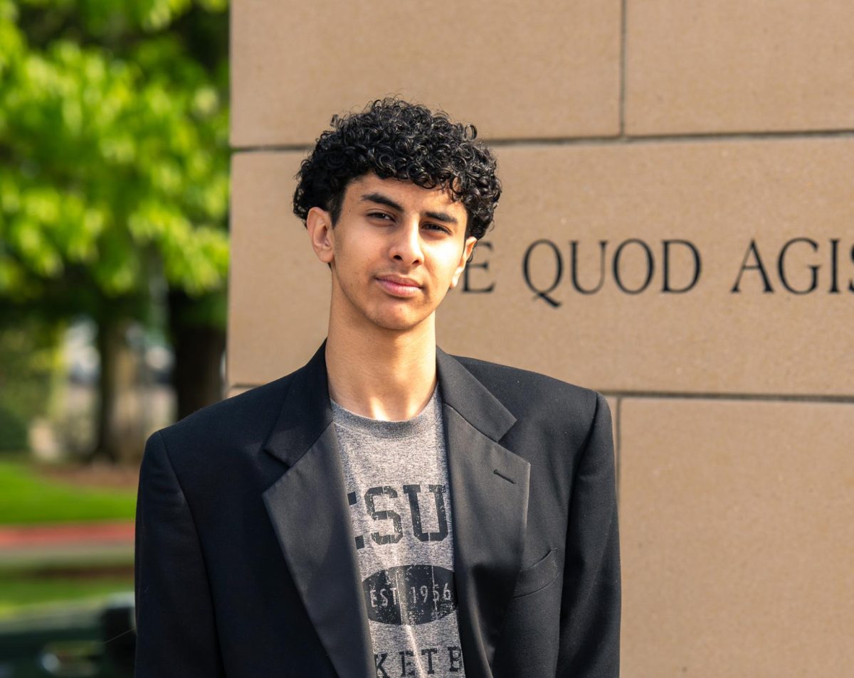 Newly elected ASB President Pavley Kamel poses in front of the Alumni quad.