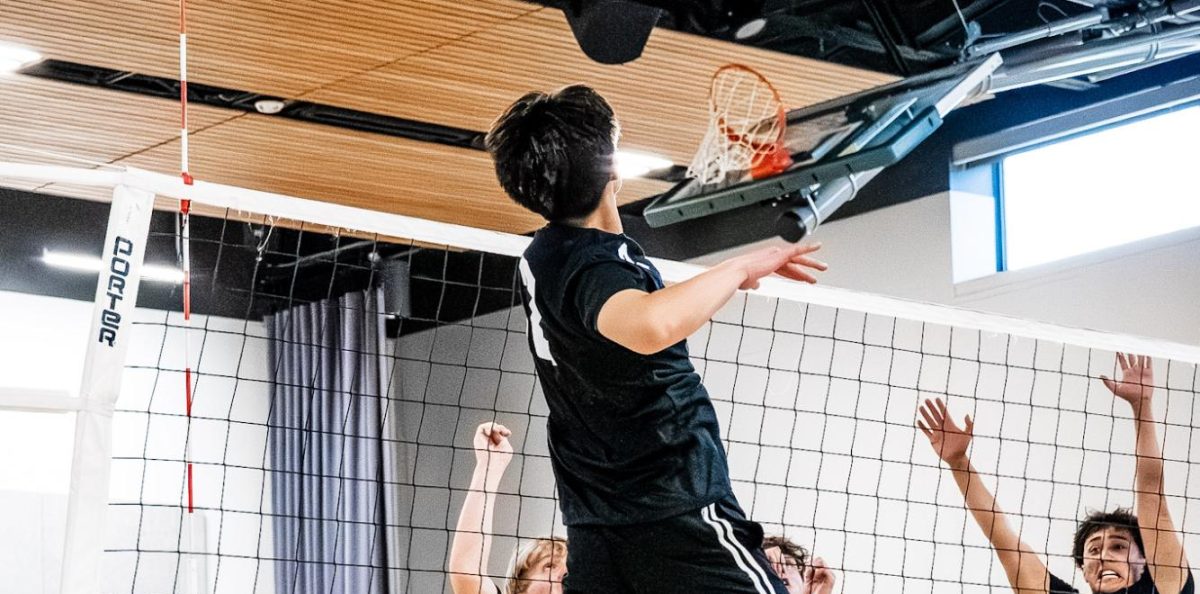 Minh Phi Nguyen (#2) plays club volleyball at Jesuit High School, a new sport. 
